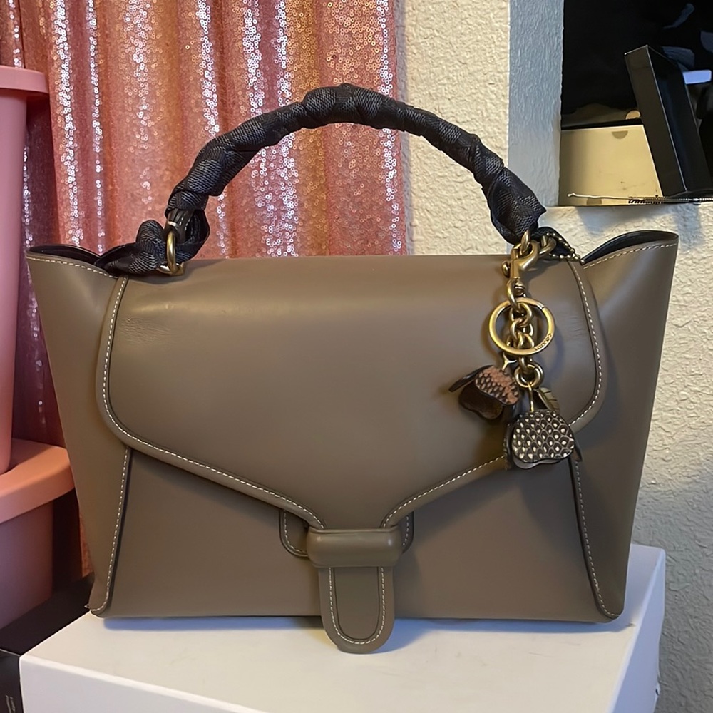 Couch Courier with charm and scarf